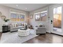 Cozy living room featuring a comfortable sofa and access to a patio at 2311 Decatur St, Denver, CO 80211