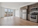 Modern kitchen with stainless steel appliances and ample natural light at 3575 Chestnut Pl # 802, Denver, CO 80216