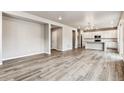 Open concept living area with hardwood floors and kitchen at 16870 Mckay Dr, Mead, CO 80542