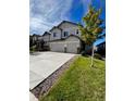 Two-story house with three-car garage and landscaping at 4773 S Wenatchee Cir, Aurora, CO 80015