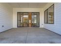 Covered patio with sliding glass doors leading inside at 11442 Autumn Moon St, Littleton, CO 80125