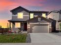 Two-story house with gray siding and a two-car garage at 359 Vista Cliff Cir, Castle Rock, CO 80104