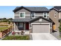 Two-story house with gray siding and a two-car garage at 359 Vista Cliff Cir, Castle Rock, CO 80104