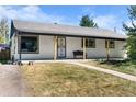 Charming ranch home with a covered porch and well-maintained lawn at 4423 E Bails Pl, Denver, CO 80222