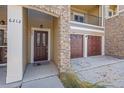 Townhouse entrance with double garage doors at 6212 Kilmer Loop # 202, Golden, CO 80403