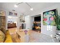 Spacious living room with fireplace and large artwork at 377 Albion St, Denver, CO 80220