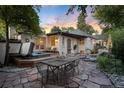 Relaxing backyard patio with hot tub, stone patio, and seating area at 377 Albion St, Denver, CO 80220