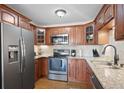 Modern kitchen featuring granite countertops and stainless steel appliances at 9335 E Center Ave # 11A, Denver, CO 80247