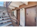 Exterior view of building showing stairs and two apartment entrances at 590 N Logan St # 210, Denver, CO 80203