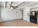 Living room featuring hardwood floors and a ceiling fan at 590 N Logan St # 210, Denver, CO 80203