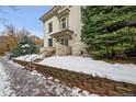 Building exterior with snow-covered steps and landscaping at 1368 N Downing St # 3, Denver, CO 80218