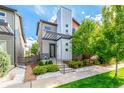 Contemporary three-story home with modern facade and landscaped yard at 1764 W 67Th Pl, Denver, CO 80221