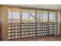 Balcony with geometric patterned screen offering views of the surrounding area at 585 S Alton Way # 4D, Denver, CO 80247