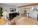 Mid-century modern living room with hardwood floors and stylish furniture at 5183 W Columbia Pl, Denver, CO 80236