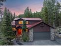 Two-story home with stone accents and red roof at 153 Regal Cir, Breckenridge, CO 80424