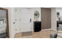 Entryway with white door, wood floors, and modern decor at 336 N Grant St # 206, Denver, CO 80203