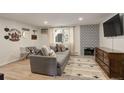 Living room with fireplace, wood floors, and southwestern decor at 336 N Grant St # 206, Denver, CO 80203