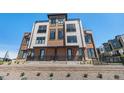 Modern three-story brick townhome with a metal balcony at 2680 Westview Way # 55, Superior, CO 80027