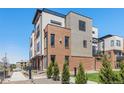 Modern three-story brick townhome with a metal balcony at 2680 Westview Way # 55, Superior, CO 80027