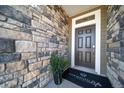 Inviting entryway with stonework and a modern door at , Aurora, CO 80019