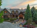 Elegant stone house entrance with landscaping at 4030 E Forbes Ct, Greenwood Village, CO 80121