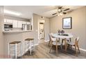 Dining area with round table and chairs, adjacent to kitchen at 5745 W Atlantic Pl # 206, Lakewood, CO 80227