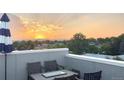 Rooftop deck with sunset views and mountain backdrop at 1245 Utica St # 105, Denver, CO 80204