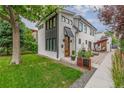 Modern home with gray and white exterior and patio at 1468 S Washington St, Denver, CO 80210