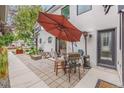 Patio with table and chairs, umbrella, and fire pit at 1468 S Washington St, Denver, CO 80210