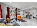 Open concept living room with a view of the front door and bedroom at 730 E Alameda Ave, Denver, CO 80209