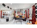 Open living room and kitchen area with mid-century modern decor at 730 E Alameda Ave, Denver, CO 80209
