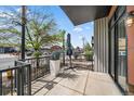 Private patio with metal railings and planter boxes at 3149 Blake St # 101, Denver, CO 80205