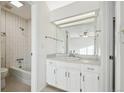 Bright bathroom with vanity, shower/tub, and tiled walls at 1193 S Sable Blvd # H, Aurora, CO 80012