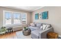 Relaxing living room with L-shaped sofa and wood floors at 700 E Ellsworth Ave # 6, Denver, CO 80209