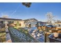 Front yard view of the house, showcasing landscaping and walkway at 5353 Quitman St, Denver, CO 80212