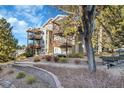 Condo building with wooden balconies and landscaping at 17662 E Loyola Dr # 2132L, Aurora, CO 80013