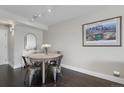 Smaller dining area with round table and four metal chairs at 1313 N Williams St # 306, Denver, CO 80218