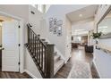 Bright and spacious entryway with staircase and hardwood floors at 138 Starlight Cir, Erie, CO 80516