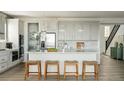 Open concept kitchen with large island and stainless steel appliances at 16985 Black Rose Pl, Parker, CO 80134