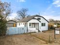 Newly remodeled home with white exterior and modern details at 5401 N Pecos St, Denver, CO 80221