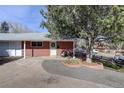 Brick ranch home with a landscaped front yard and paved walkway at 6193 S Prescott St, Littleton, CO 80120