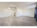 Bright living room with wood-look floors and neutral decor at 4940 E Donald Ave # 8, Denver, CO 80222