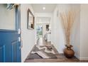 Bright and airy entryway with a view to the kitchen at 1123 Williams Loop, Elizabeth, CO 80107