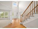 Bright and spacious entryway with hardwood floors and staircase at 19052 E Lake Dr, Aurora, CO 80016