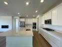 Modern kitchen featuring stainless steel appliances and an island at 1255 Sunrise Dr, Erie, CO 80516