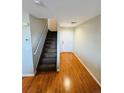 Light wood floors and carpeted stairs in entryway at 5307 S Picadilly Way, Aurora, CO 80015