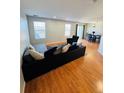 Spacious living room with hardwood floors and sectional sofa at 5307 S Picadilly Way, Aurora, CO 80015