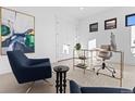 Modern home office with two armchairs and a gold desk at 5049 W 32Nd Ave, Denver, CO 80212