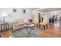 Bright living room with hardwood floors and modern furniture at 1230 S Julian St, Denver, CO 80219