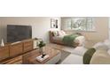 Studio apartment living room with sofa, bed, and wood floors at 969 S Pearl St # 204, Denver, CO 80209